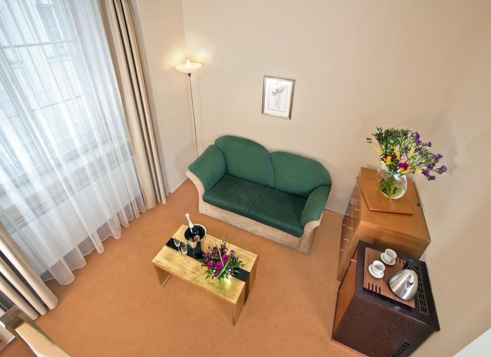Michelangelo Grand Hotel Prague Exterior photo A living room in a typical apartment