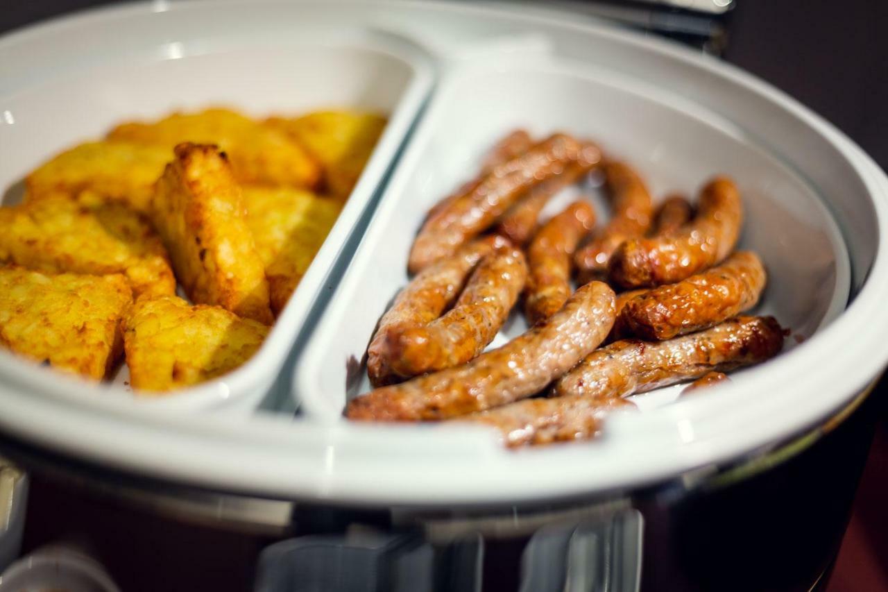 Michelangelo Grand Hotel Prague Exterior photo Sausage and hash browns